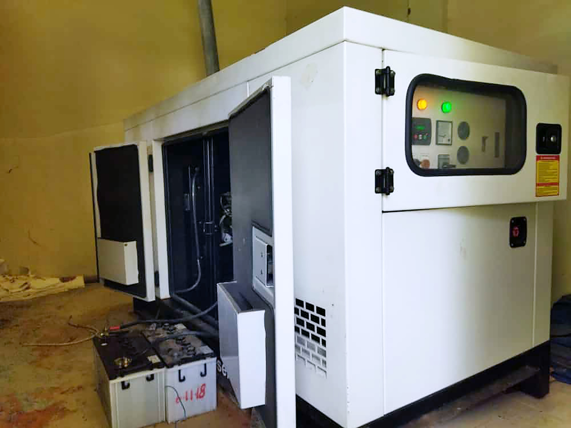 Standby diesel generator receiving oil and filter maintenance
