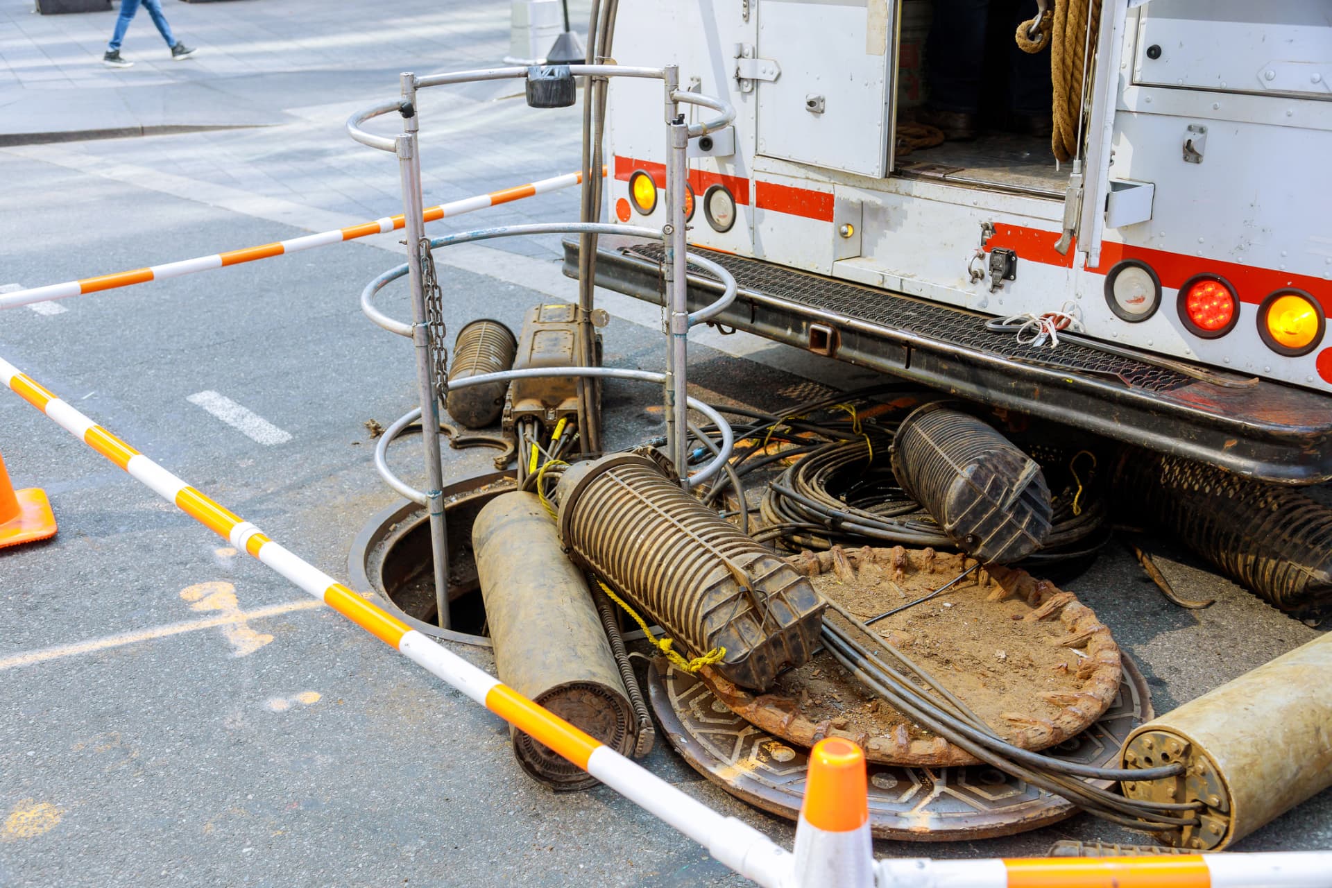 Service truck with hoses and tooling laid out at a work site