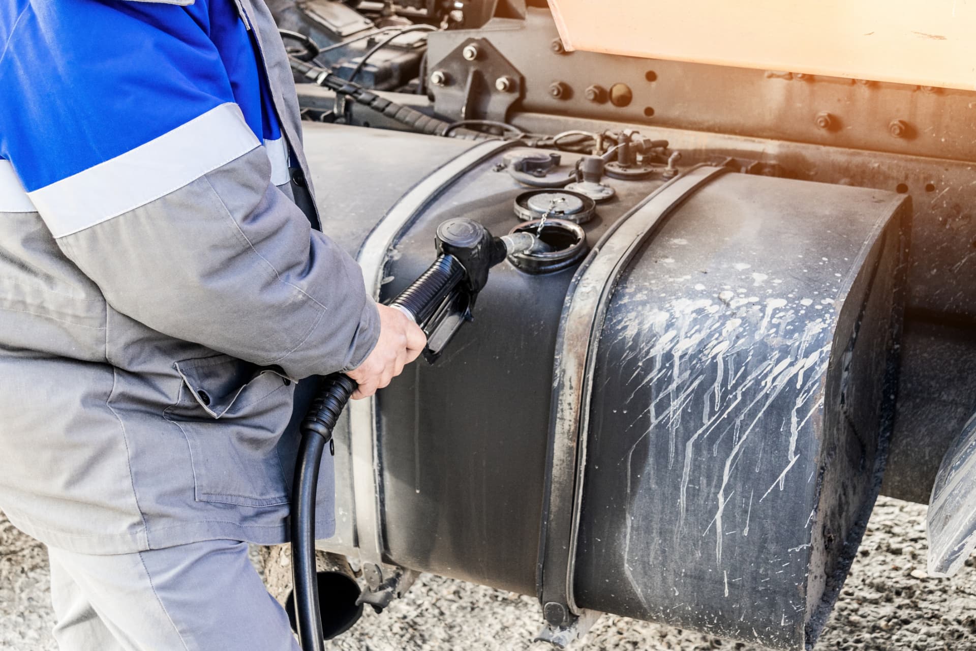 Diesel Fuelmasters technician polishing stored diesel fuel beside a bulk storage tank in Louisiana