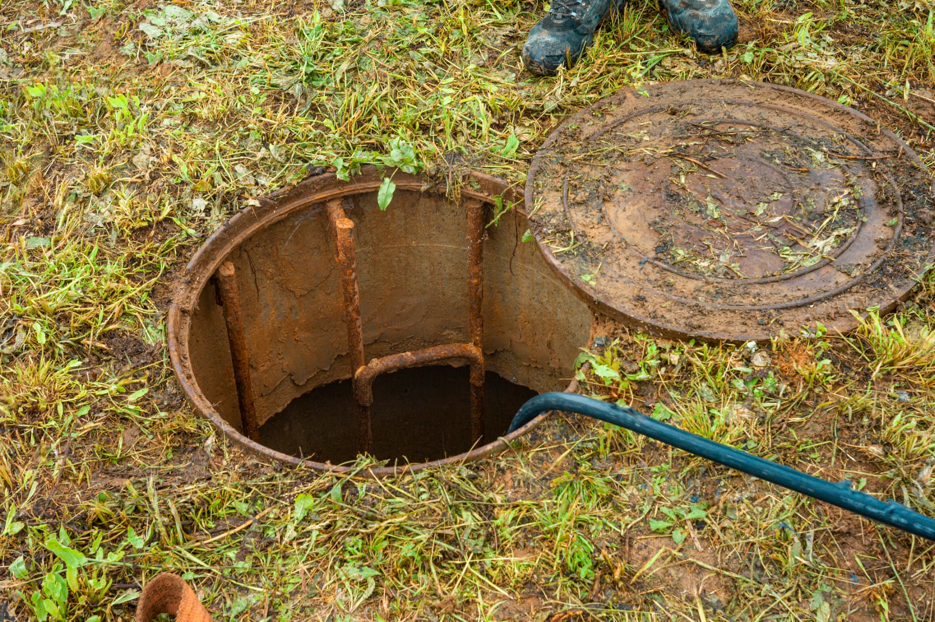 Open tank access chamber with hose ready for pump-out